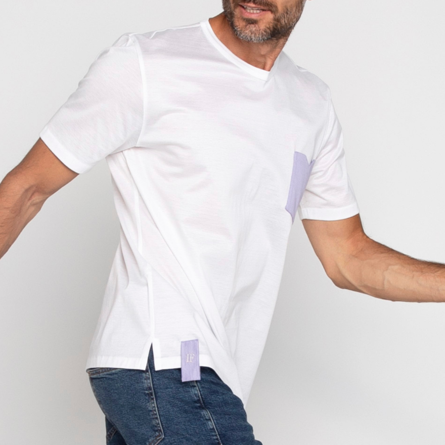 Man wearing white cotton t-shirt with contrasting color pocket square and logo loop, by Italo Ferretti